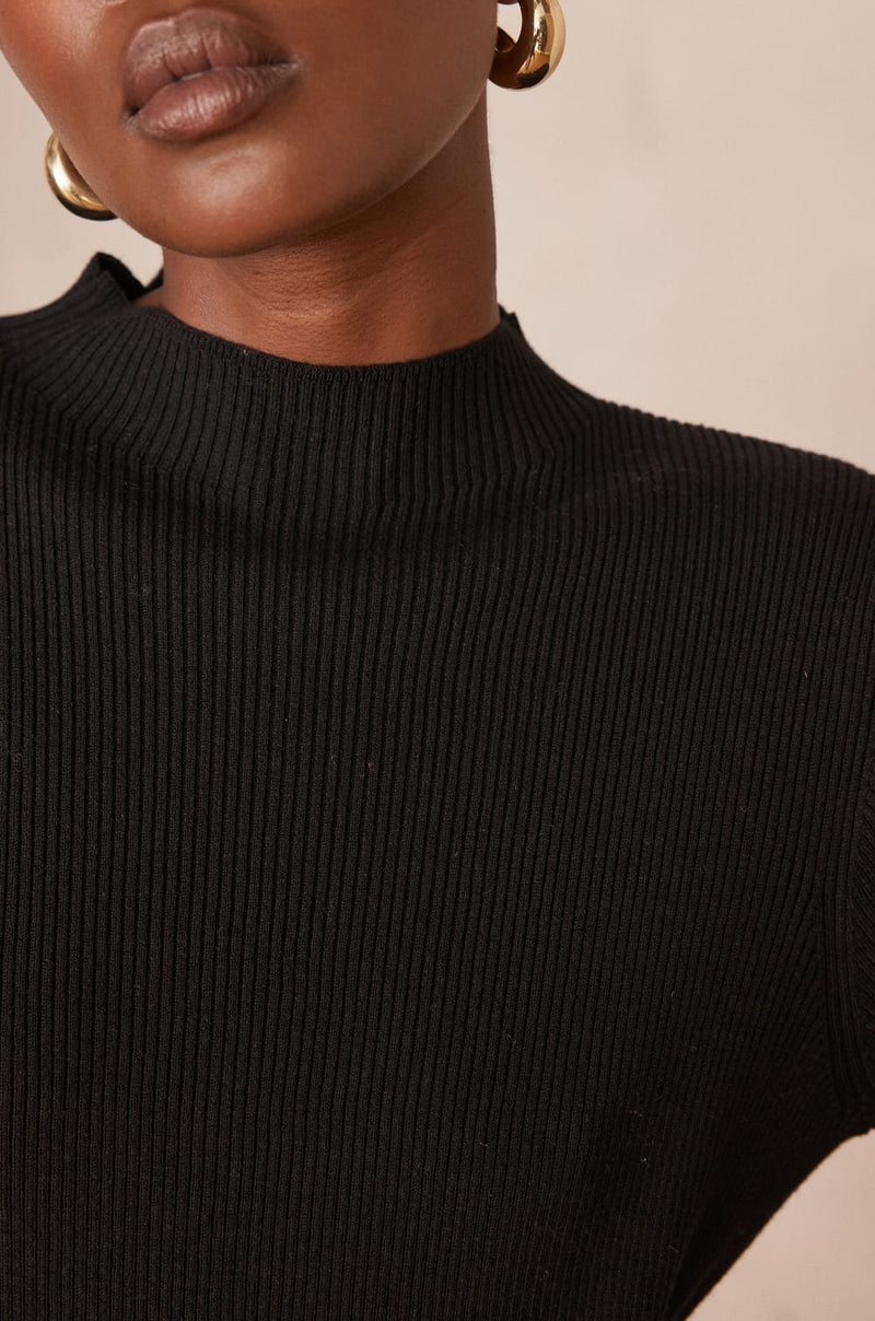 MARTIKA BLACK PLEATED KNIT DRESS